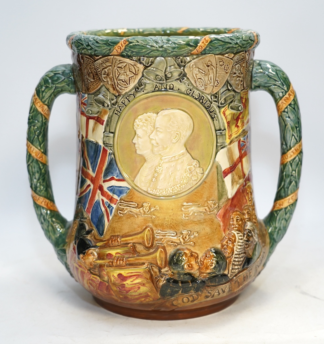 A Doulton limited edition commemorative loving cup, George V and Mary silver jubilee, 804/1000, 26cm. Condition - fine crazing to glaze, good